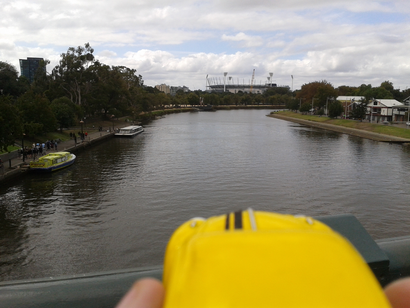 Yarra river with Melbourne Cricket Ground in background.